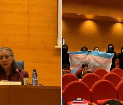 Un grupo de estudiantes con banderas del colectivo trans y no binario se manifestaron durante un acto de Marcela Lagarde en la Universidad Complutense de Madrid, el miércoles 20 de marzo. (TOWANDA REBELS)